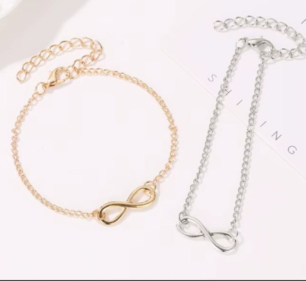 Infinity charm bracelet in gold and silver