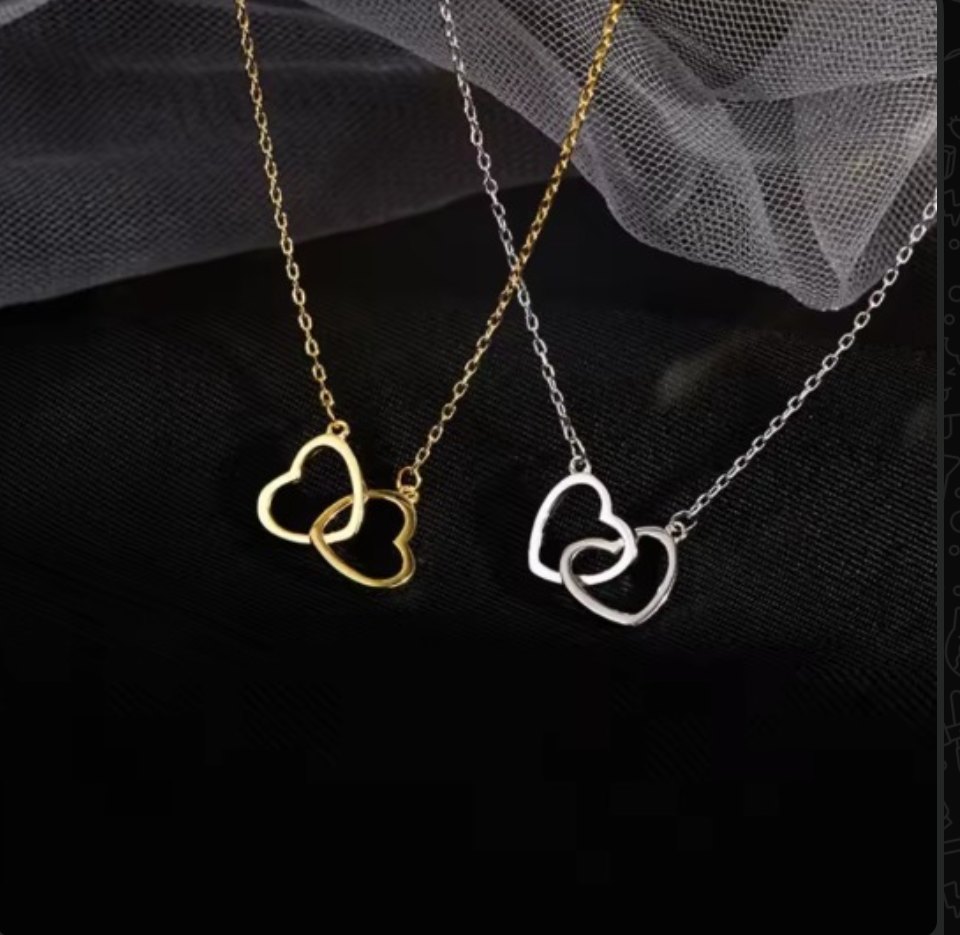 Double heart pendant necklace in gold and silver